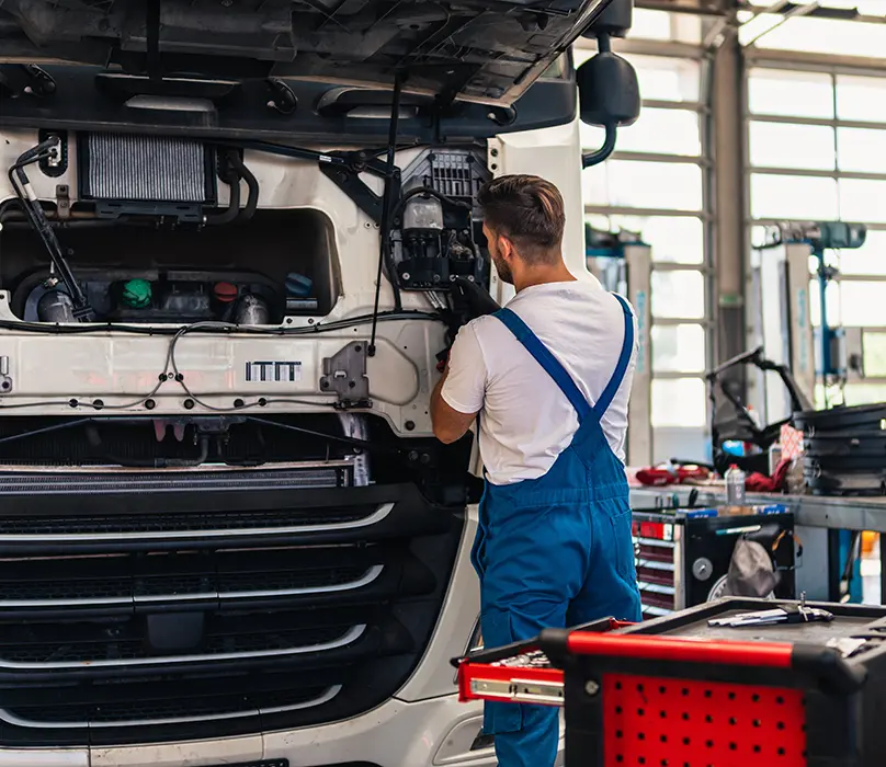 HGV Mechanic Working On Vehicle